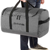 Dakine EQ Duffle 70L Bag 2024 - A large grey duffel bag with black straps and zippers.
