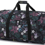 Dakine EQ Duffle 70L Bag 2024 - A large duffel bag with a black background and a repeating pattern of green, purple, and white leaves.