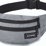 Dakine Hip Pack - A gray hip pack with two zippered pockets and a black zipper pull on one pocket.
