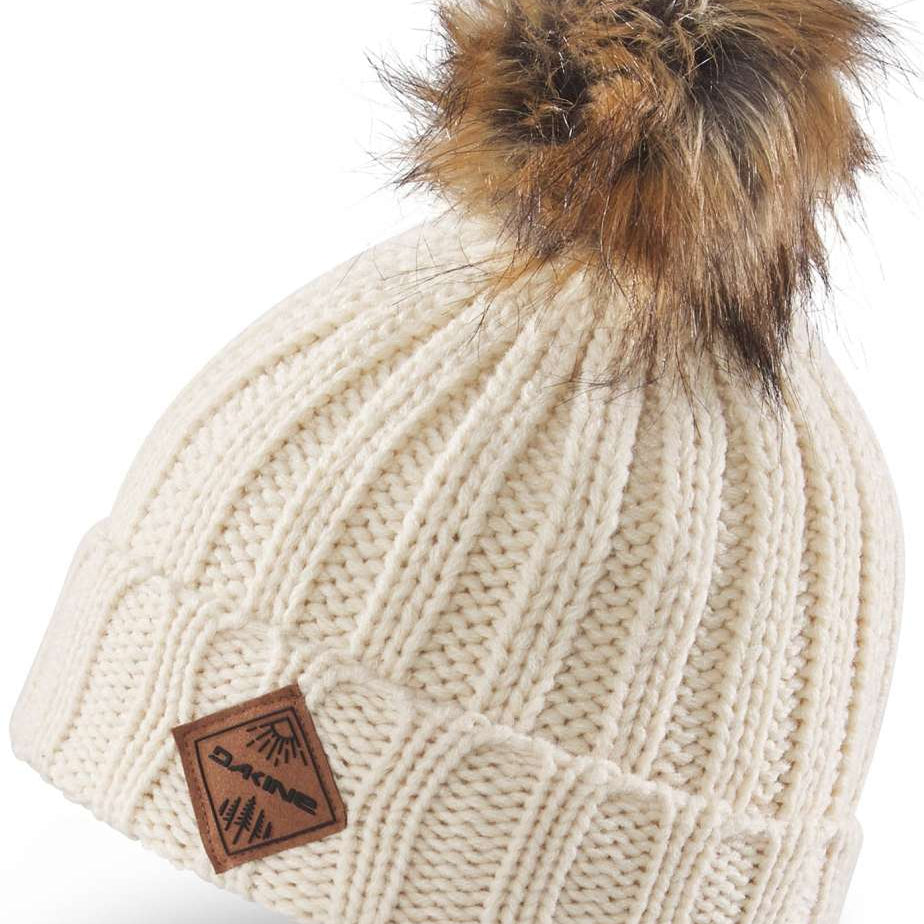 Dakine Kids Kylie Beanie 2022-2023 - A cream-colored beanie with a brown faux fur pom-pom on top.