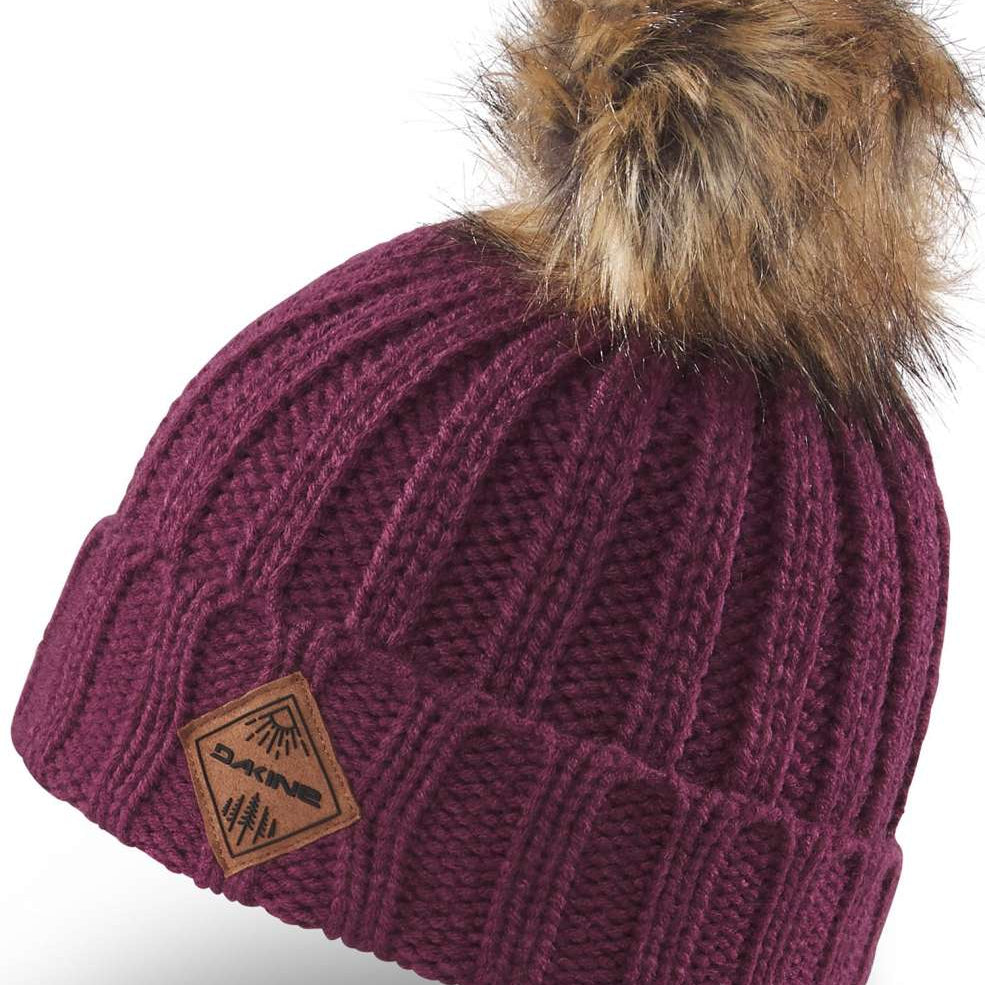 Dakine Kids Kylie Beanie 2022-2023 - A maroon beanie with a brown faux fur pom-pom on top.