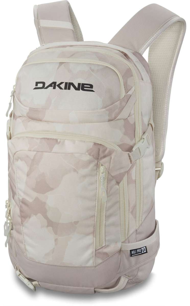 Dakine Ladies Heli Pro 20L Backpack 2024 - A light-colored backpack with a subtle pattern of darker shapes, featuring two zippered pockets and a handle on top.