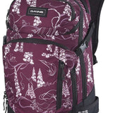 Dakine Ladies Heli Pro 20L Backpack 2024 - A purple backpack with white floral pattern and black trim, featuring a zippered front pocket and adjustable straps.