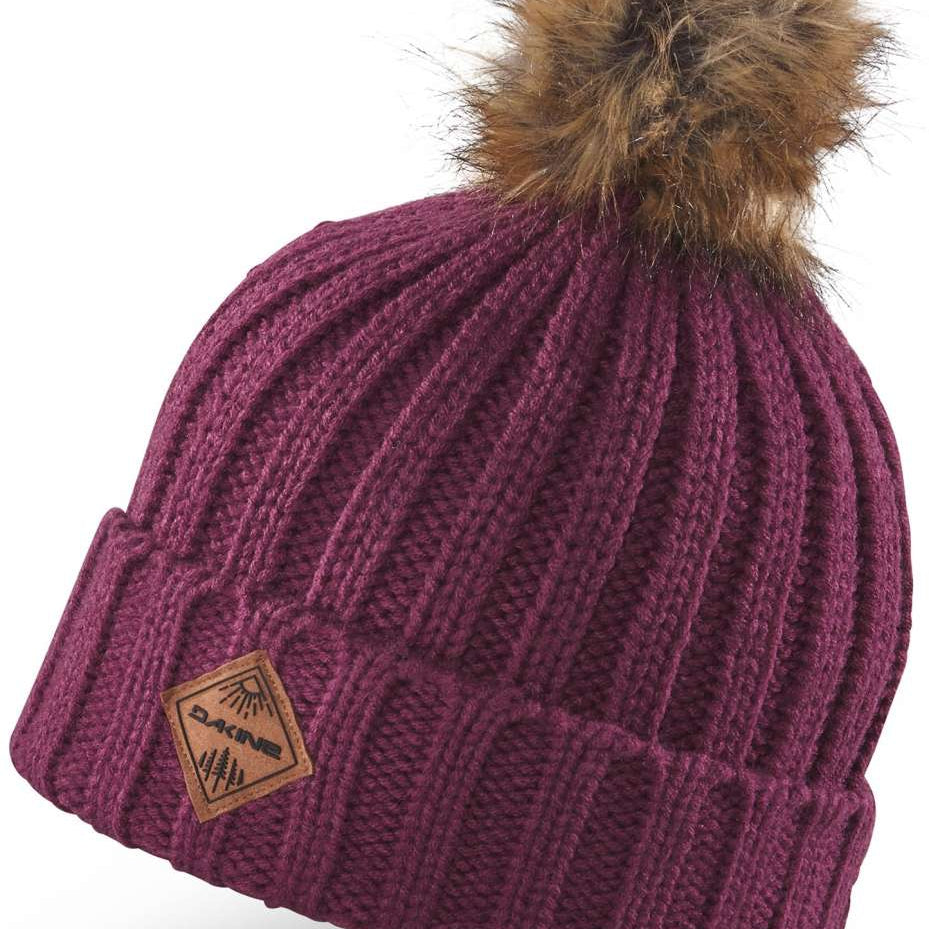 Dakine Ladies Kylie Beanie 2022-2023 - A maroon beanie with a brown faux fur pom-pom on top.