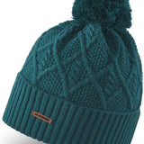 Dakine Ladies Mia Beanie 2022-2023 - A dark teal beanie with a cable-knit pattern and a large pom-pom on top.