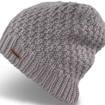 Dakine Ladies Zoe Beanie 2024 - A light gray beanie with a ribbed cuff and a small brown leather label on the front.
