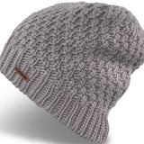 Dakine Ladies Zoe Beanie 2024 - A light gray beanie with a ribbed cuff and a small brown leather label on the front.