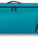 Dakine - Low roller board bag with a black top panel, teal bottom panel and white lettering.
