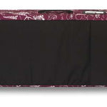 Dakine Low Roller Board Bag 2024 - Black bag with white floral pattern along top edge and black handle on end.