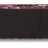 Dakine Low Roller Board Bag 2024 - Black bag with white floral pattern along top edge and black handle on end.