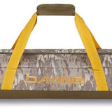 Dakine Padded Ski Sleeve 2024 - A padded sleeve with a zippered top and yellow zipper pull, featuring a brown camouflage pattern on its exterior.