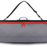 Dakine - Pipe Board Bag 2024 is shown from a front view, featuring a gray exterior with orange accents and a zippered top.