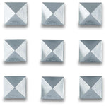 Dakine Pyramid Stud Stomp Pad 2024 - A pyramid-shaped stud stomp pad with a silver-colored metal base and four black rubber studs.
