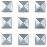 Dakine Pyramid Stud Stomp Pad 2024 - A pyramid-shaped stud stomp pad with a silver-colored metal base and four black rubber studs.