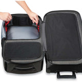 Dakine Split Roller 85L 2022-2023 - Black roller bag with red zipper pulls and black wheels.