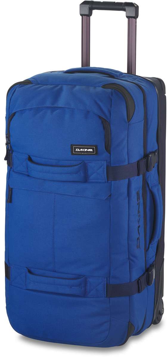Dakine Split Roller 85L 2022-2023 - A large blue roller bag with black wheels and handle, featuring a zippered front pocket and two side pockets.