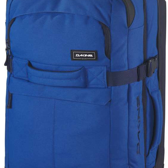 Dakine Split Roller 85L 2022-2023 - A large blue roller bag with black wheels and handle, featuring a zippered front pocket and two side pockets.