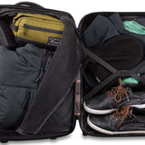 Dakine Status Roller 42L 2022-2023 - Black roller bag with black wheels and handle, featuring a zippered pocket on top and two side pockets.