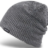 Dakine Tall Boy Beanie 2024 - A black beanie with a subtle white marled pattern and a small black tag on the cuff that reads "DAKINE" in white letters.