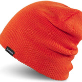 Dakine Tall Boy Beanie 2024 - A bright orange beanie with a black tag on the front that says "DAKINE" in white letters.