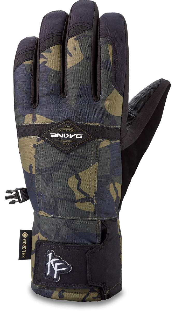 Dakine Team Bronco GORE-TEX Gloves 2022-2023 - A pair of gloves with a camouflage pattern and black trim, featuring a strap on the wrist.