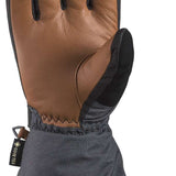 Dakine Titan GORE-TEX Leather Short Glove - A brown leather glove with black trim and stitching, featuring a thumb strap and adjustable wrist strap.