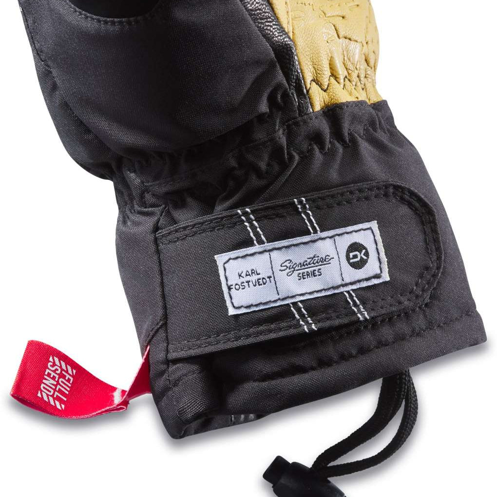 Dakine TM Fillmore K Fostvedt Glove 2024 - A black glove with a white logo on the wrist and a red pull tab.