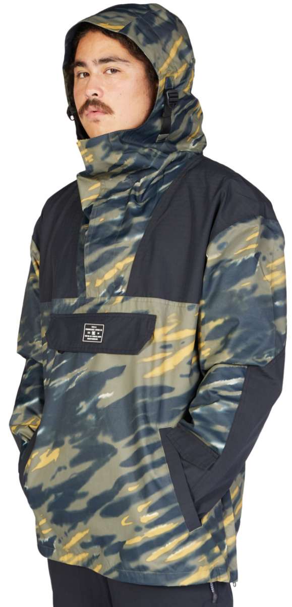 DC 43 Anorak Jacket 2023 - A camouflage-printed jacket with a hood and black accents on the shoulders, sleeves, and chest pocket.