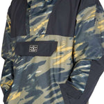 DC 43 Anorak Jacket 2023 - A camouflage-printed jacket with a hood and zippered pockets.