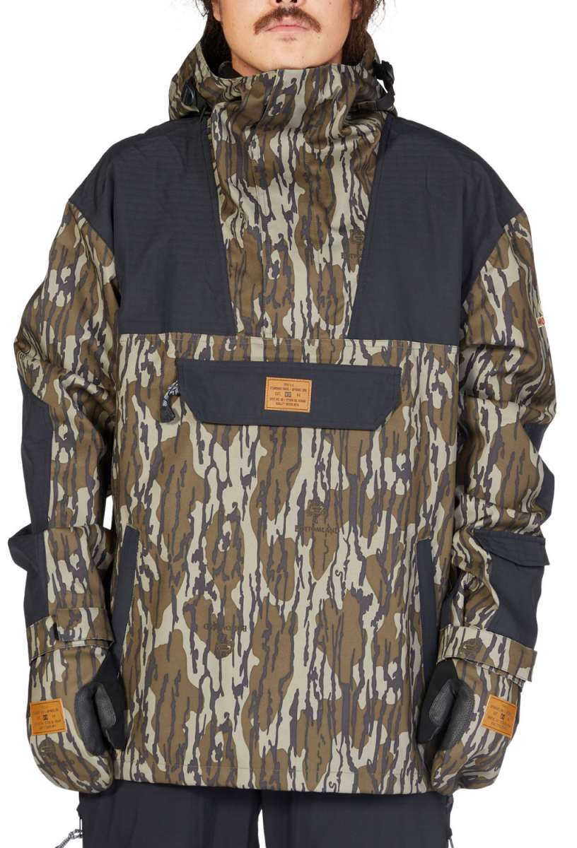 DC 43 Anorak Jacket 2023 - A camouflage jacket with a hood and zippered pockets.