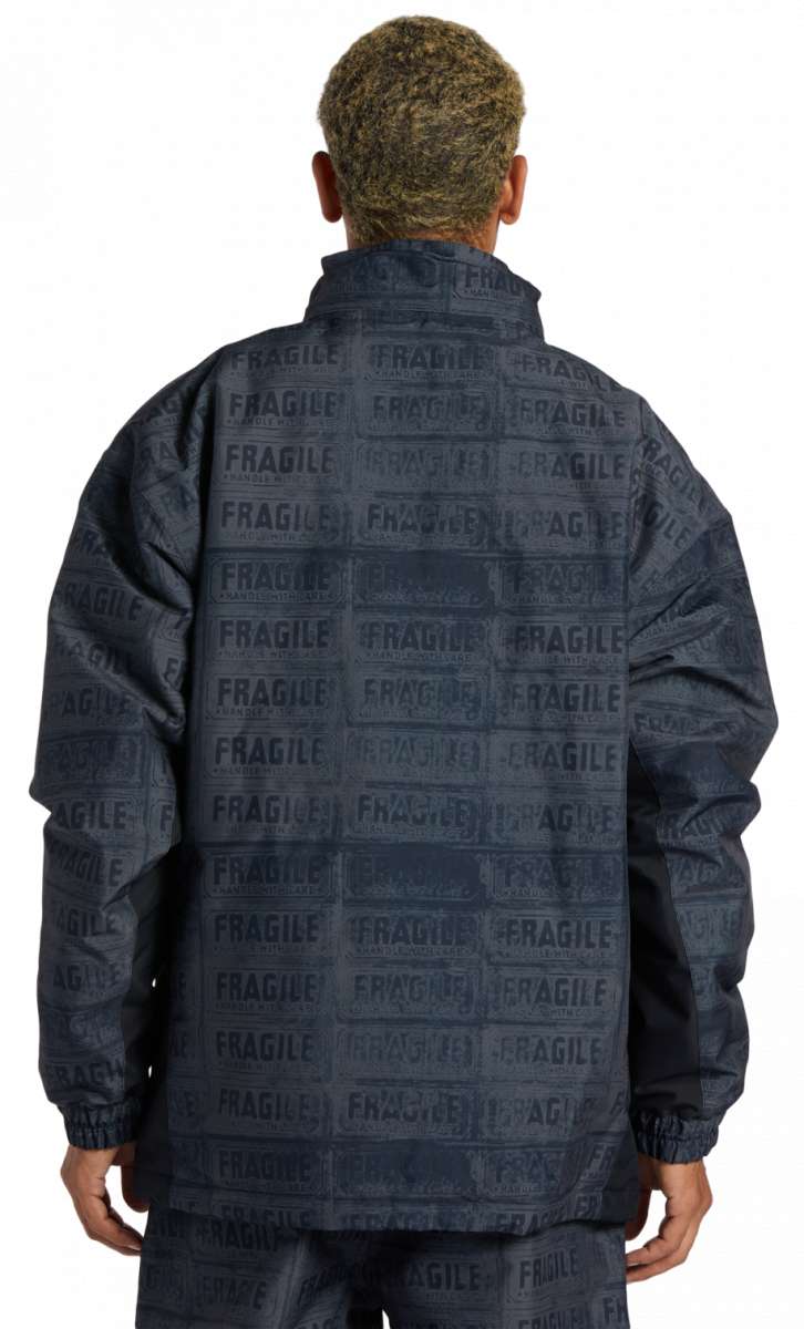 DC AW Vista Shell Jacket 2024 - A black jacket with a repeating pattern of white rectangles featuring the word "fragile" in various fonts and orientations.
