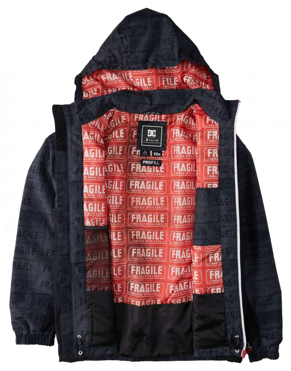 DC AW Vista Shell Jacket 2024 - A black jacket with a subtle pattern of small white snowflakes and a repeating "DC" logo in gray.