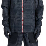 DC AW Vista Shell Jacket 2024 - A black jacket with a red zipper and white logo on the left chest.