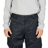 DC Banshee Insulated Pant 2023 - Black insulated snow pants with a zippered pocket on the thigh and adjustable Velcro straps at the waist.