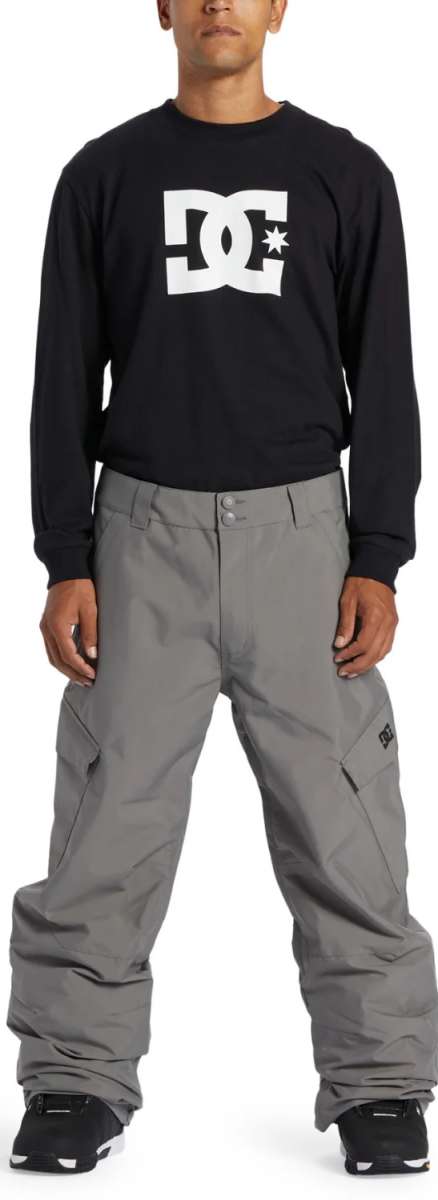 DC Banshee Insulated Pant 2024 - Black snow pants with a white DC logo on the left thigh and black insulated lining visible through the pant's mesh material.