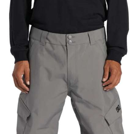 DC Banshee Insulated Pant 2024 - Black snow pants with a white DC logo on the left thigh and black insulated lining visible through the pant's mesh material.