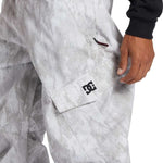 DC Banshee Insulated Pant 2024 - A pair of snowboard pants with a subtle gray and white marbled pattern on a light gray background.