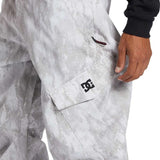 DC Banshee Insulated Pant 2024 - A pair of snowboard pants with a subtle gray and white marbled pattern on a light gray background.