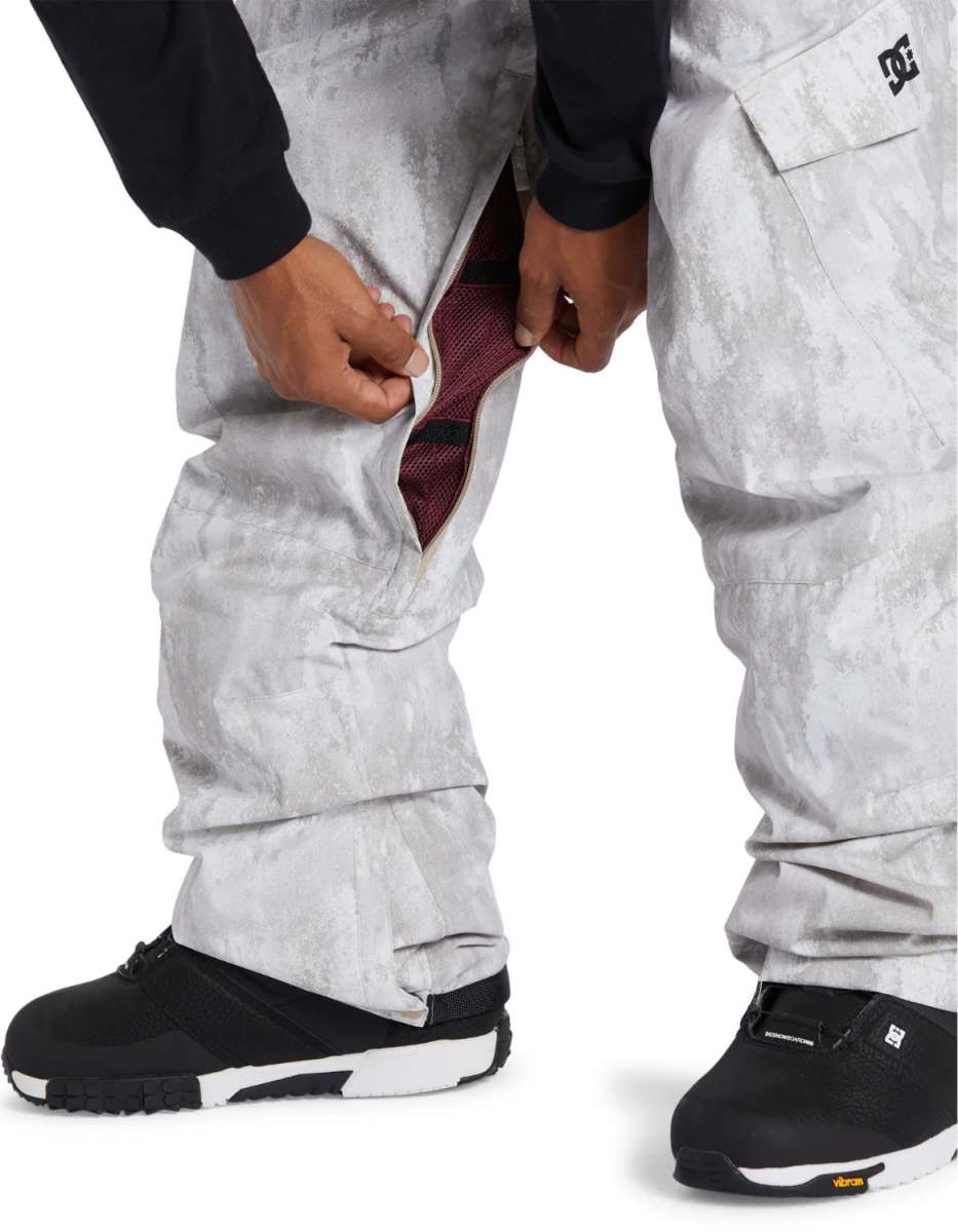 DC Banshee Insulated Pant 2024 - A pair of gray snowboard pants with a subtle marbled pattern, featuring black accents and a zippered pocket on the right thigh.