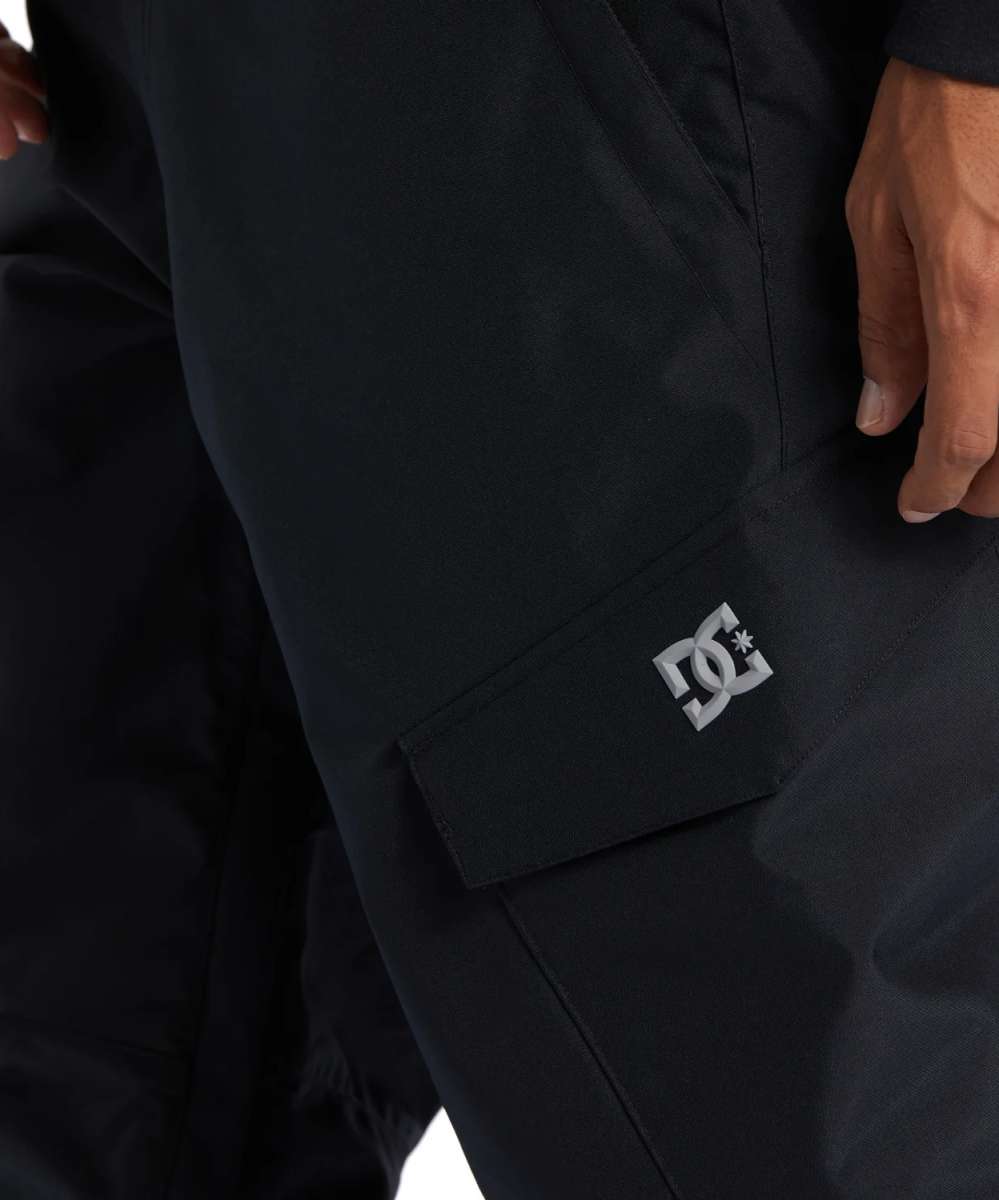 DC Banshee Insulated Pant 2024 - Black insulated snow pants with a white DC logo on the left leg cuff.