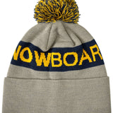 DC Chester Beanie 2023 - A gray beanie with a yellow and blue pom-pom on top.