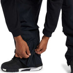 DC Code Shell Pant 2024 - Black pants with zippered pockets on each thigh.