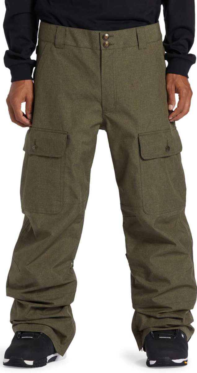 DC Code Shell Pant 2024 - Olive green pants with two zippered cargo pockets on each thigh and a button fly closure.