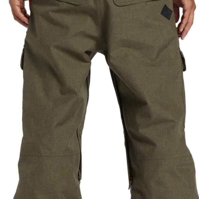 DC Code Shell Pant 2024 - Olive green pants with a subtle diagonal stripe pattern on the side of one leg.