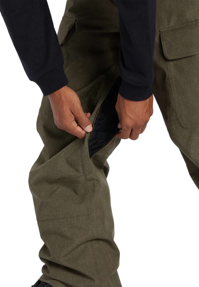 DC Code Shell Pant 2024 - Olive green pants with zippered ankle cuffs.