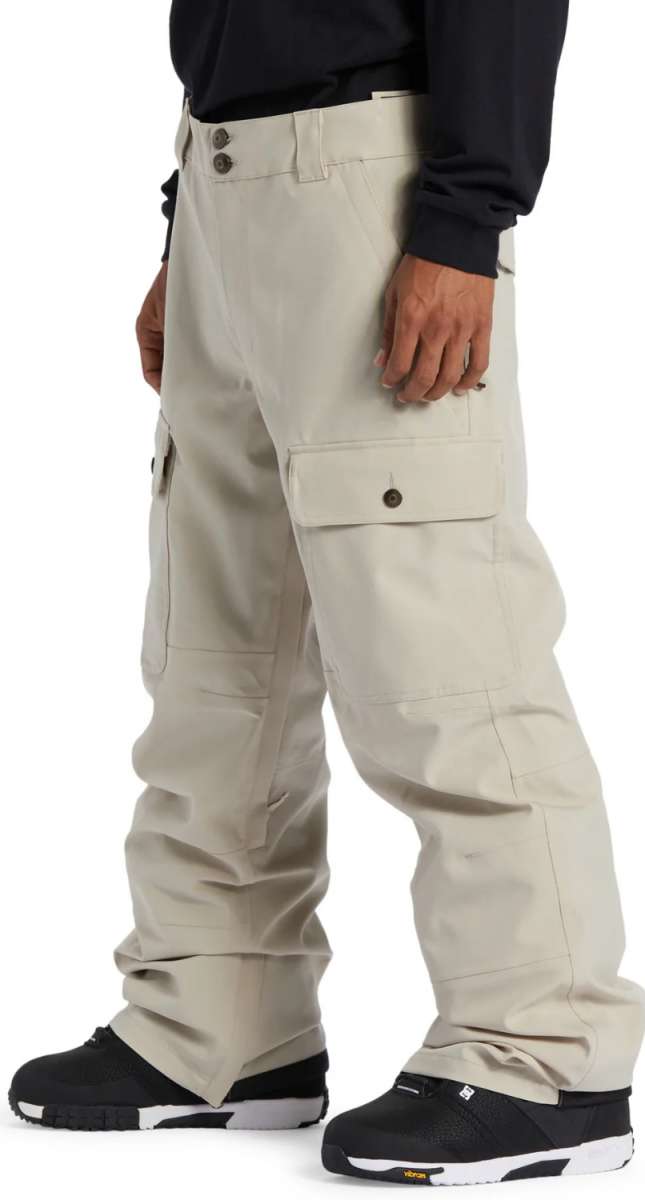 DC Code Shell Pant 2024 - Beige pants with a subtle sheen, featuring two front pockets and a zippered fly.