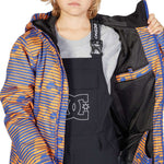 DC Juniors Propaganda Insulated Jacket 2023 - A blue and orange striped jacket with a hood, worn by a model over a gray shirt.