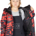 DC Juniors Propaganda Insulated Jacket 2023 - A black and red camouflage patterned jacket with a hood, worn by a young girl with blonde hair.