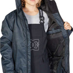 DC Juniors Propaganda Insulated Jacket 2023 - A black and white striped jacket with a hood, worn by a young girl with blonde hair.