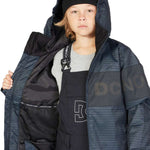 DC Juniors Propaganda Insulated Jacket - A black jacket with a white logo on the chest and a hood, worn by a model in front of a gray background.